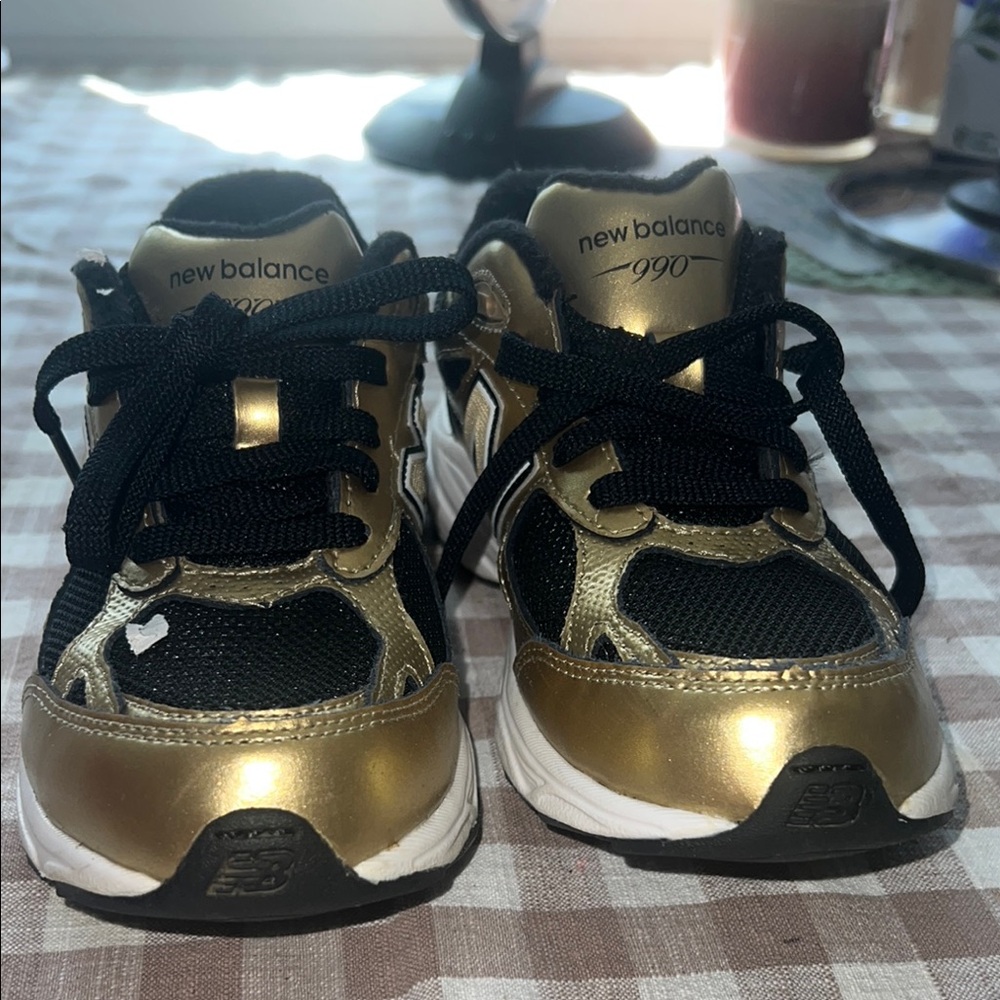 New Balance Black and Gold Sneakers with Metallic Finish